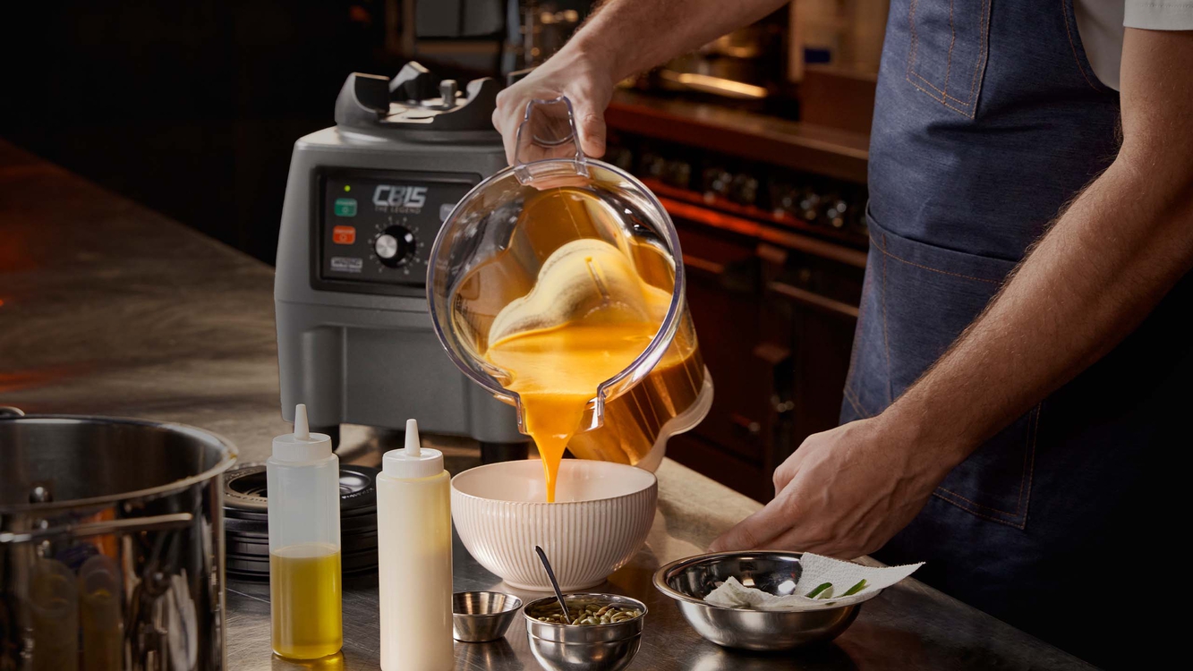 Chef pouring liquid from blender | Waring